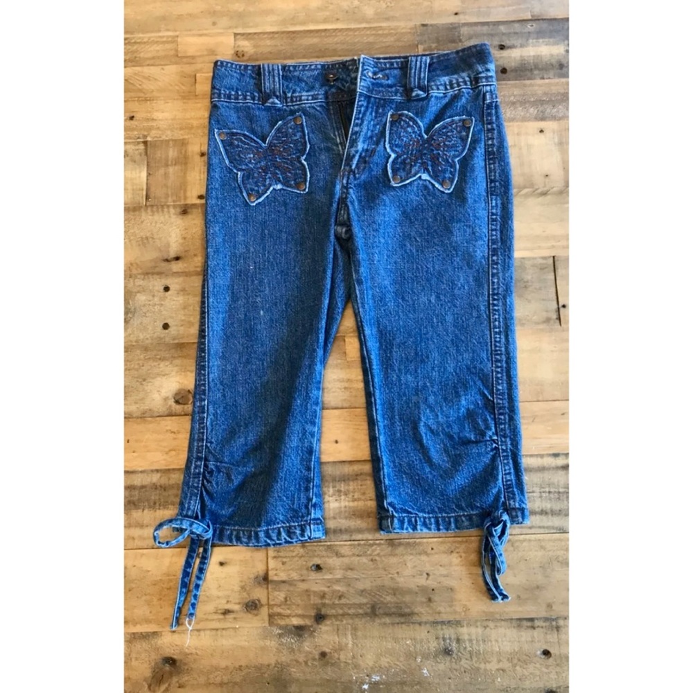Girls Calvin Klein jeans with butterfly design